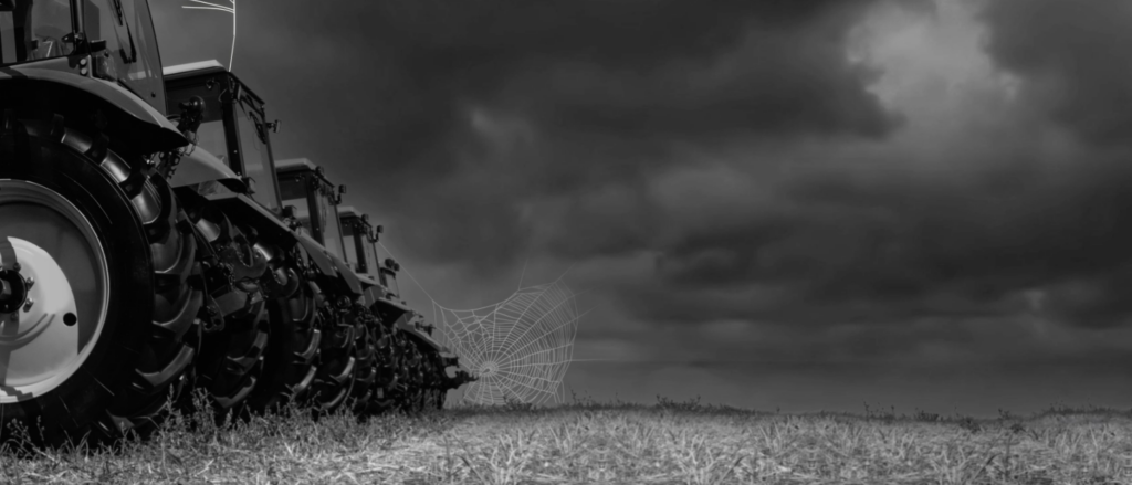 ag equipment in black and white with cob webs